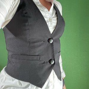 Black vest adjustable in back to ensure form fitting